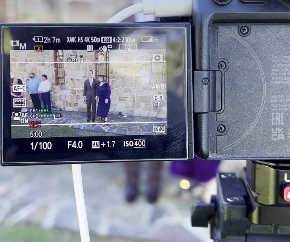 Camera monitor showing the wedding ceremony being streamed live